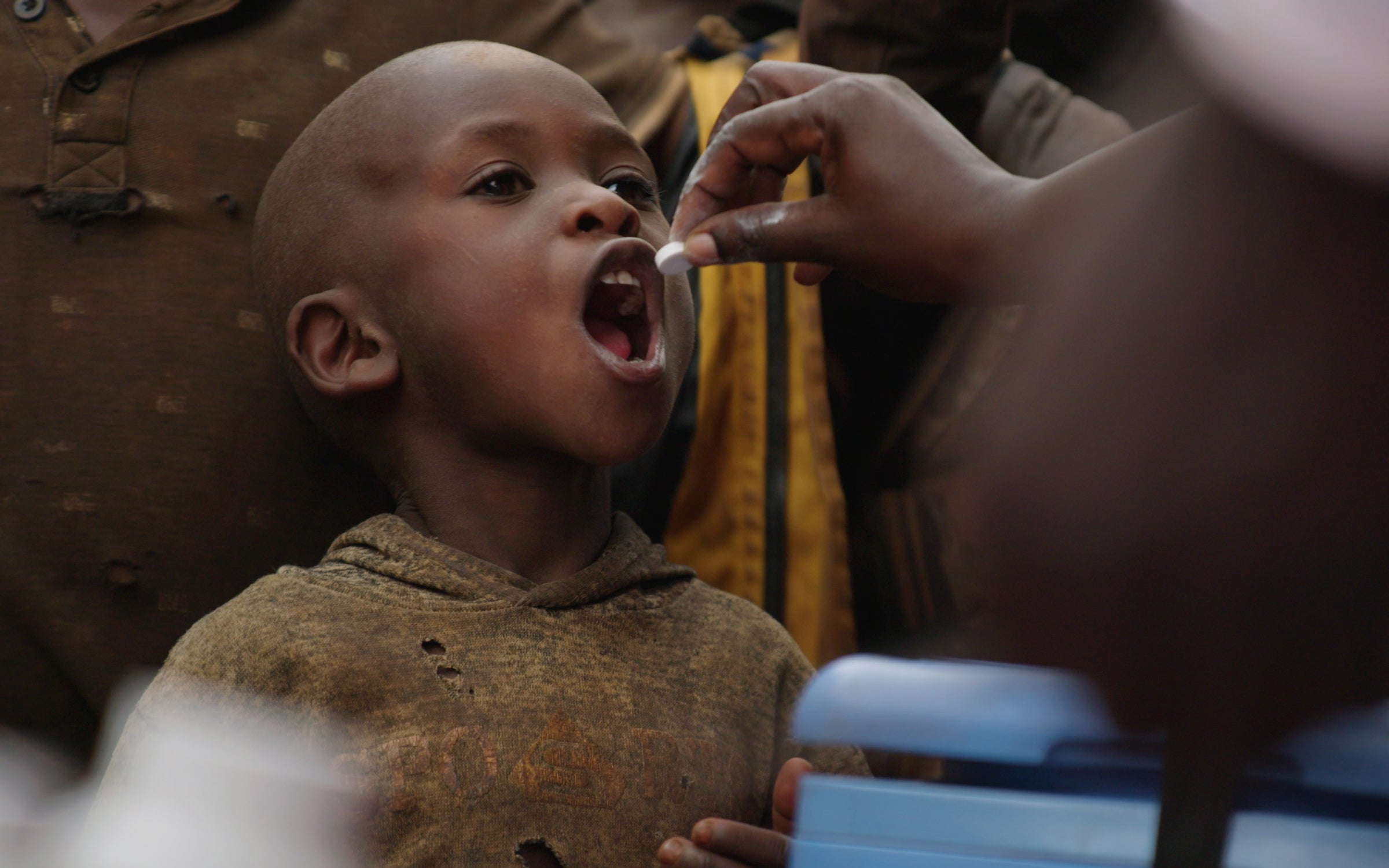 A child receives an oral vaccine.