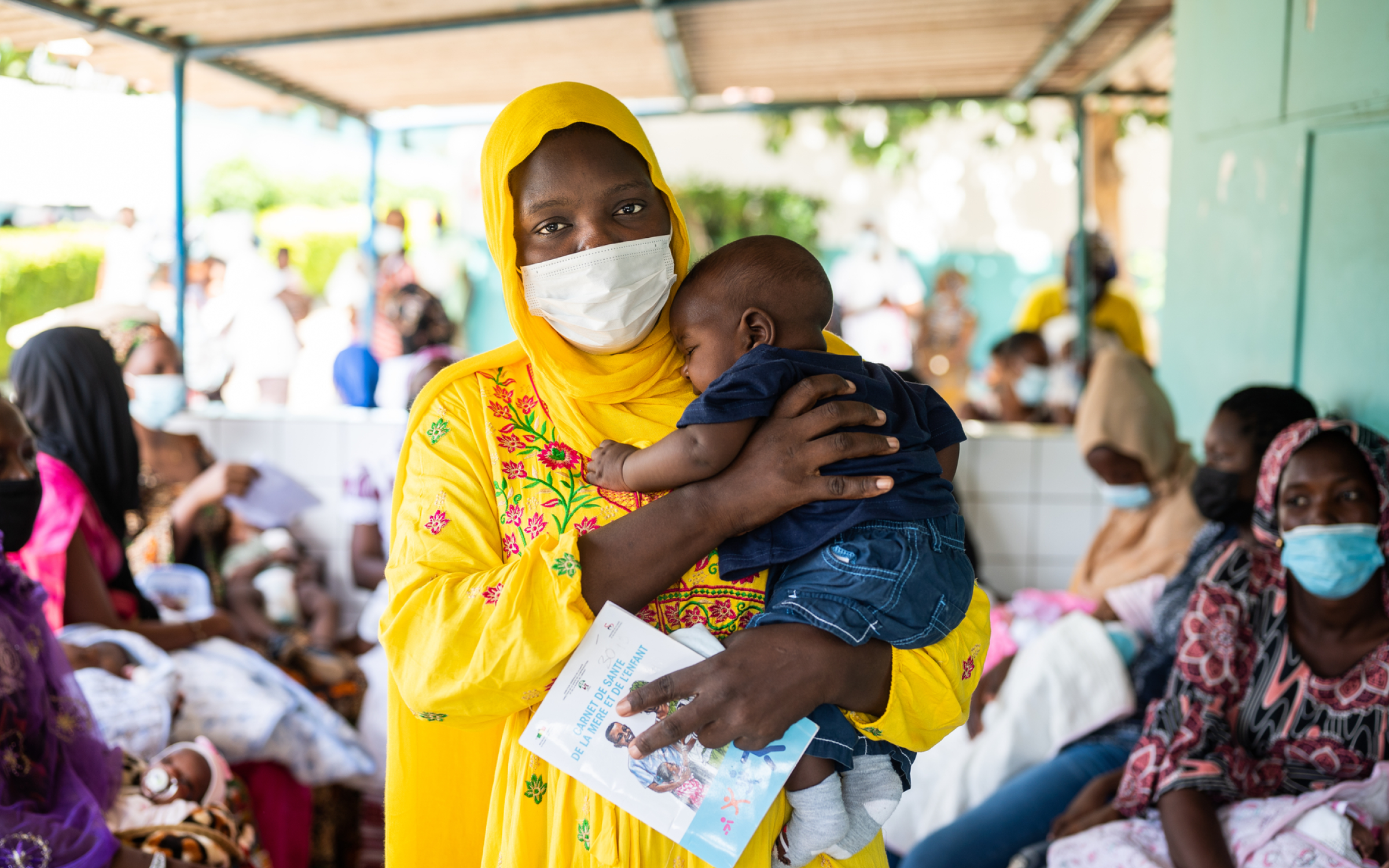 Portrait of a mother and four-month-old son after receiving the pentavalent vaccine, injectable and oral polio vaccines, in Dakar, Senegal.