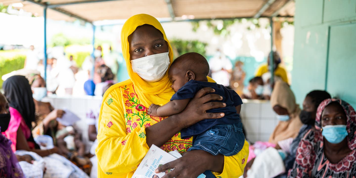 Portrait of a mother and four-month-old son after receiving the pentavalent vaccine, injectable and oral polio vaccines, in Dakar, Senegal.