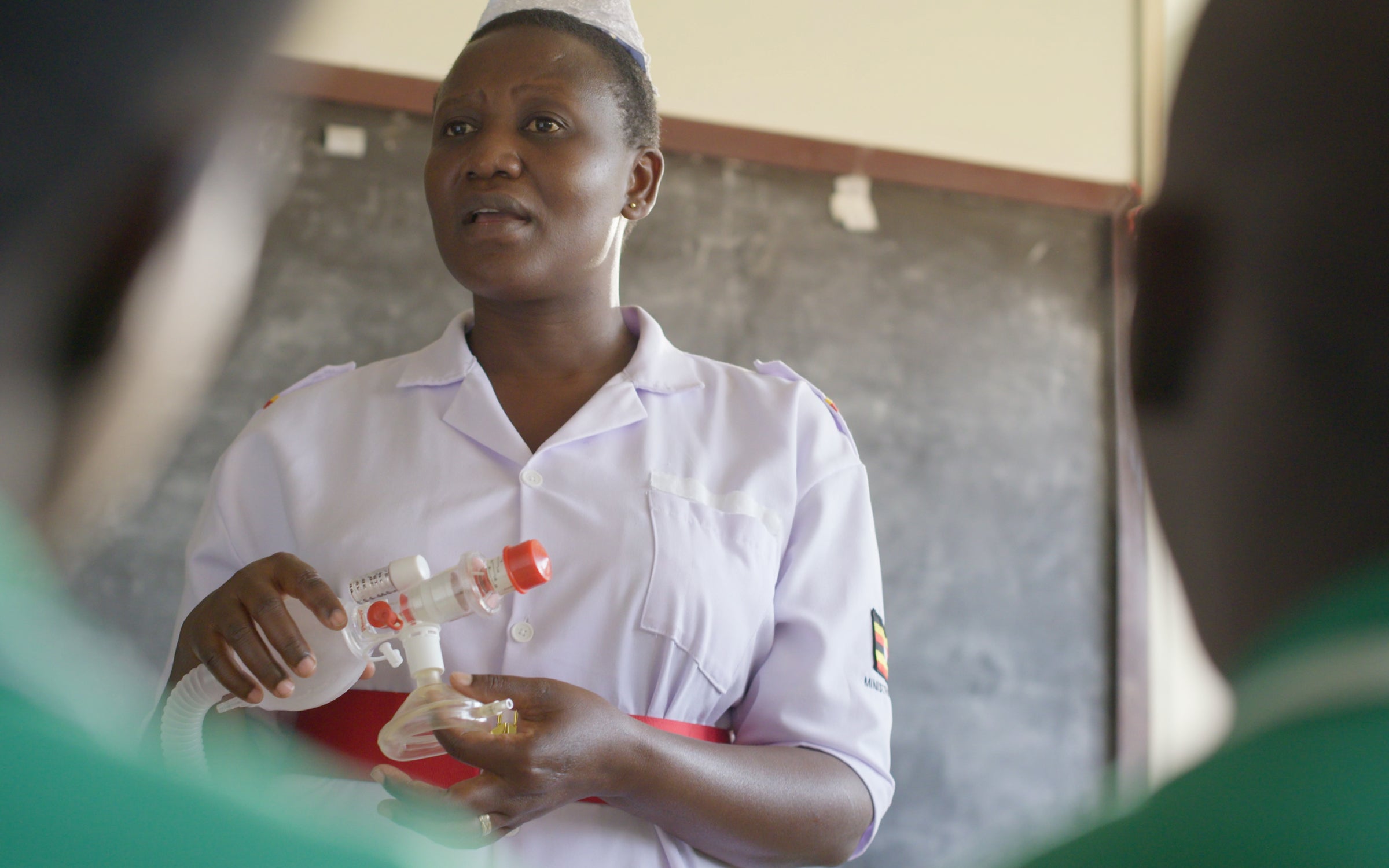 Eva Nangalo demonstrating a lifesaving resuscitation technique