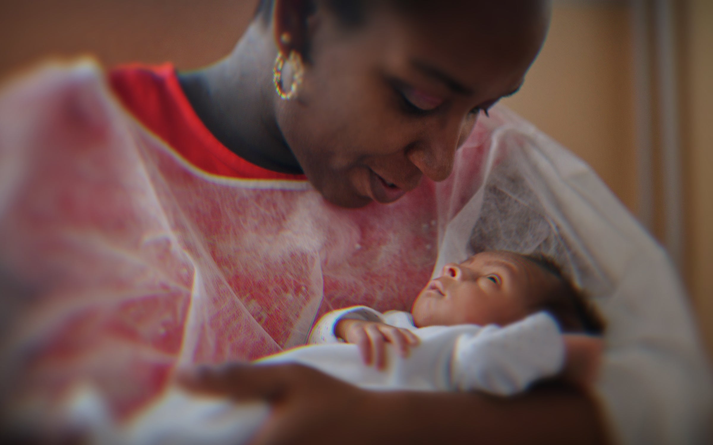 A mother holds a newborn baby.