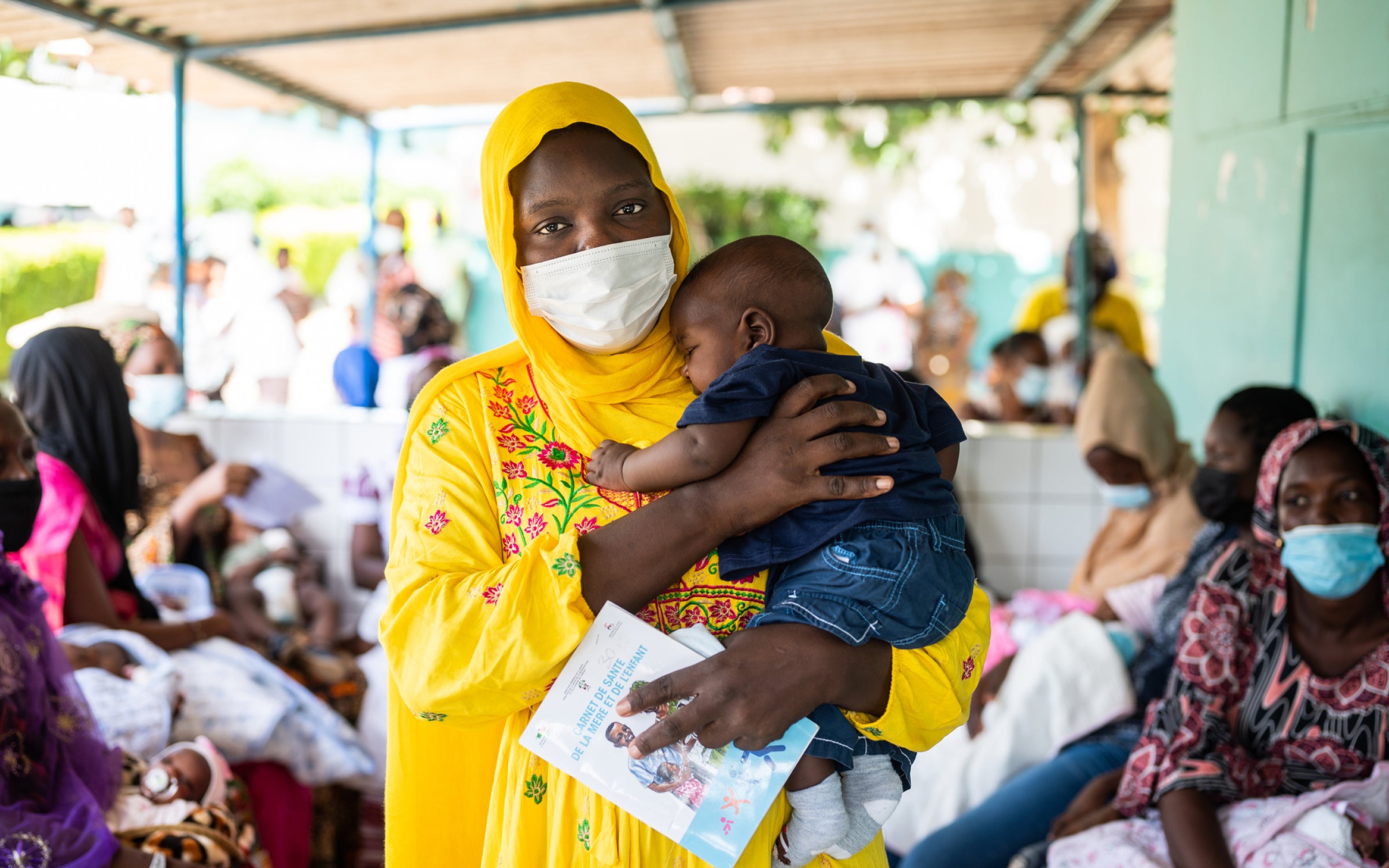 Portrait of a mother and four-month-old son after receiving the pentavalent vaccine, injectable and oral polio vaccines, in Dakar, Senegal.