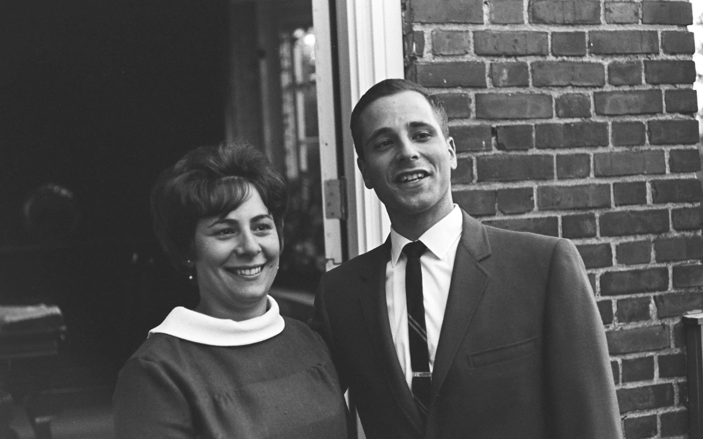 Paul Stocklin standing with a woman smiling.