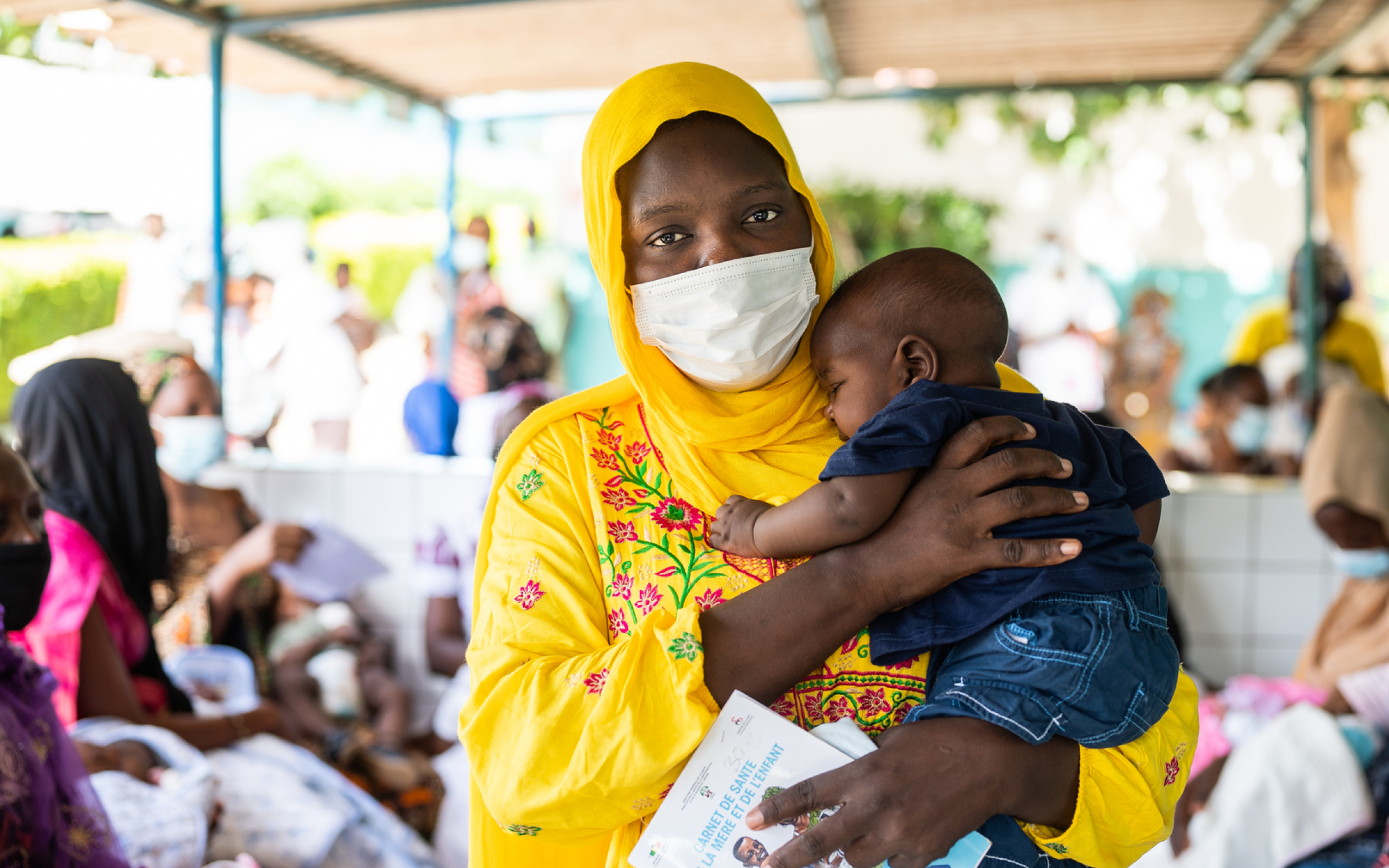 Portrait of a mother and four-month-old son after receiving the pentavalent vaccine, injectable and oral polio vaccines, in Dakar, Senegal.