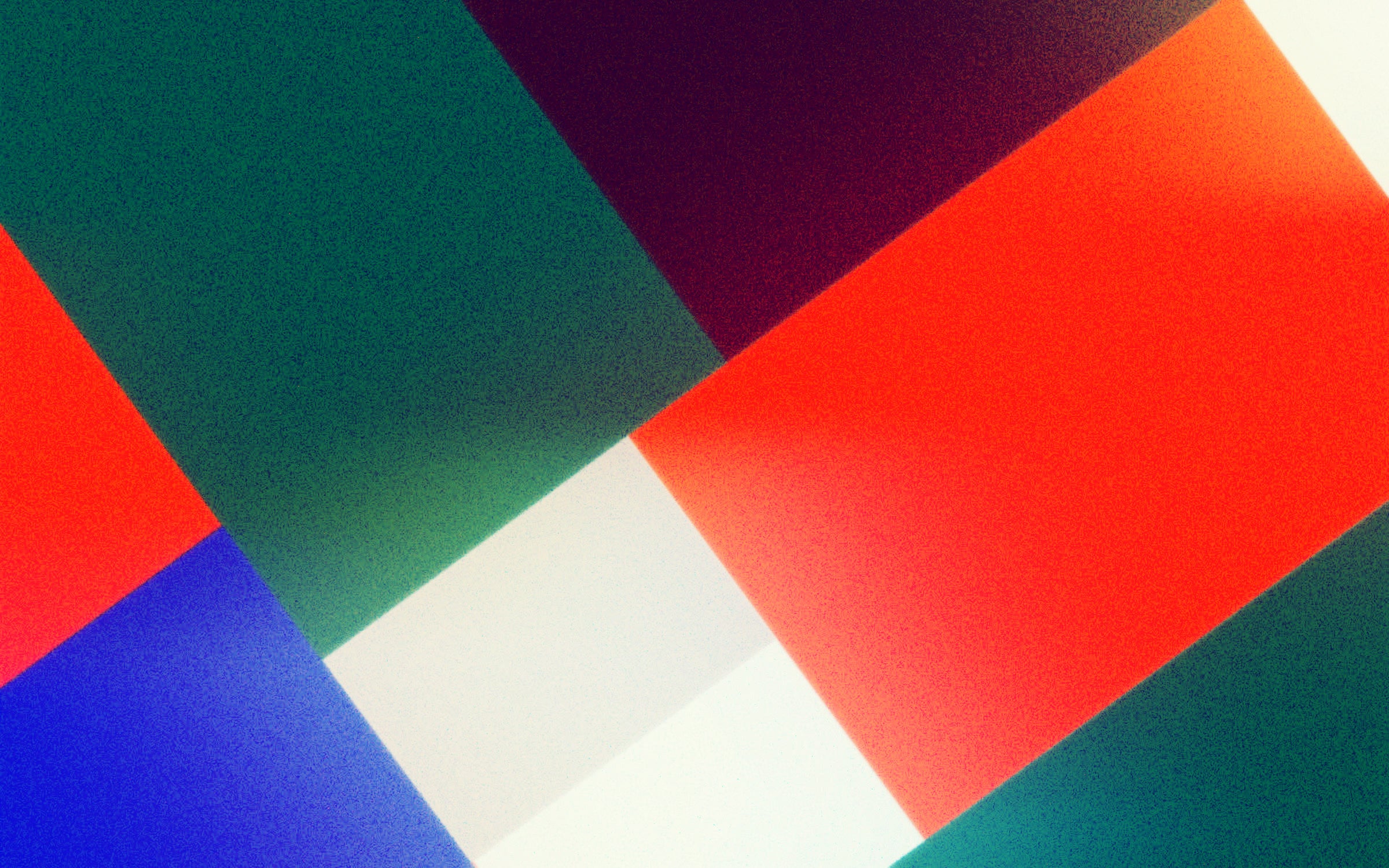 Animated blocks of color move in a circular motion.